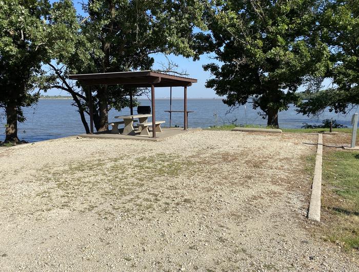 A photo of Site 05 of Loop CCRE at CANNING CREEK with Picnic Table, Electricity Hookup, Fire Pit, Shade, Waterfront, Water Hookup