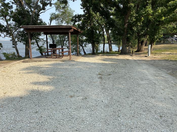 A photo of Site 06 of Loop CCRE at CANNING CREEK with Picnic Table, Electricity Hookup, Fire Pit, Shade, Waterfront, Water Hookup