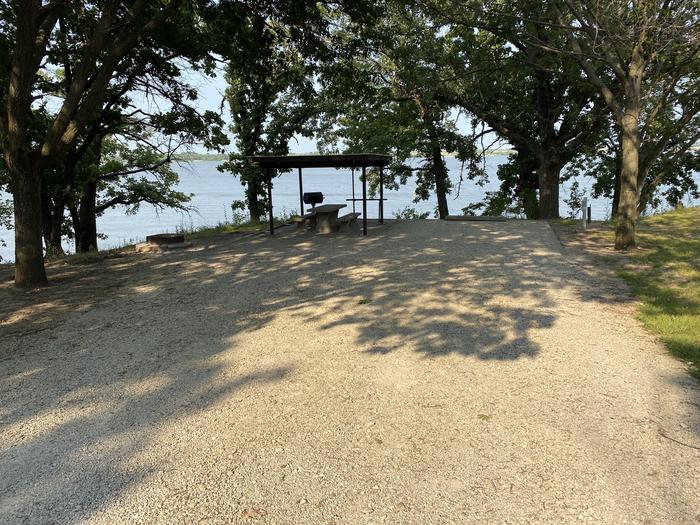 A photo of Site 13 of Loop CCRE at CANNING CREEK with Picnic Table, Electricity Hookup, Fire Pit, Shade, Waterfront, Water Hookup