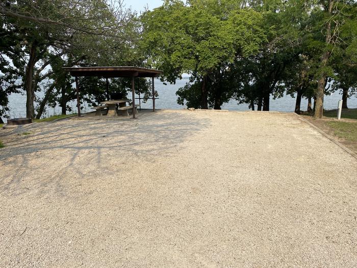 A photo of Site 14 of Loop CCRE at CANNING CREEK with Picnic Table, Electricity Hookup, Fire Pit, Shade, Waterfront, Water Hookup