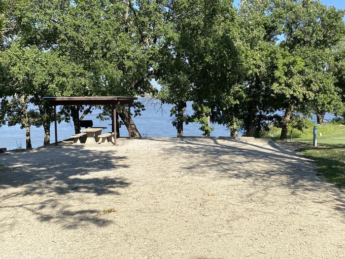 A photo of Site 15 of Loop CCRE at CANNING CREEK with Picnic Table, Electricity Hookup, Fire Pit, Shade, Waterfront, Water Hookup