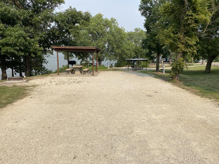A photo of Site 16 of Loop CCRE at CANNING CREEK with Picnic Table, Electricity Hookup, Fire Pit, Shade, Waterfront, Water Hookup