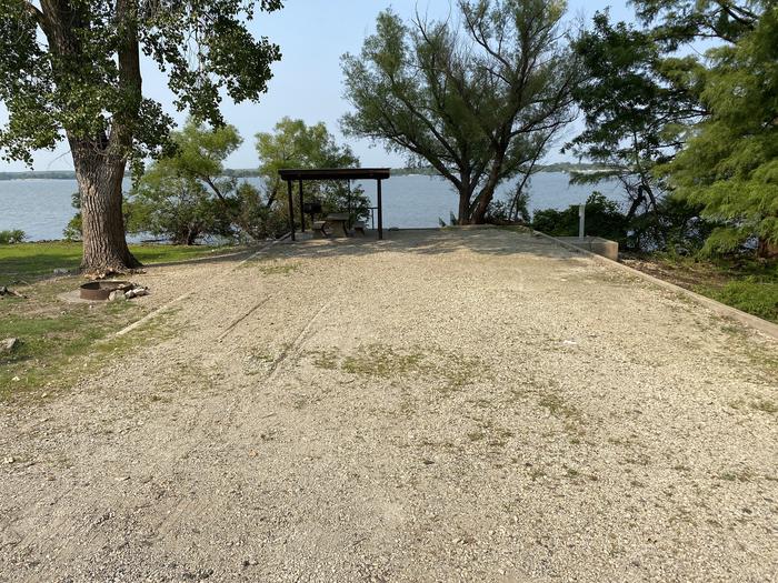 A photo of Site 19 of Loop CCRE at CANNING CREEK with Picnic Table, Electricity Hookup, Fire Pit, Shade, Waterfront, Water Hookup