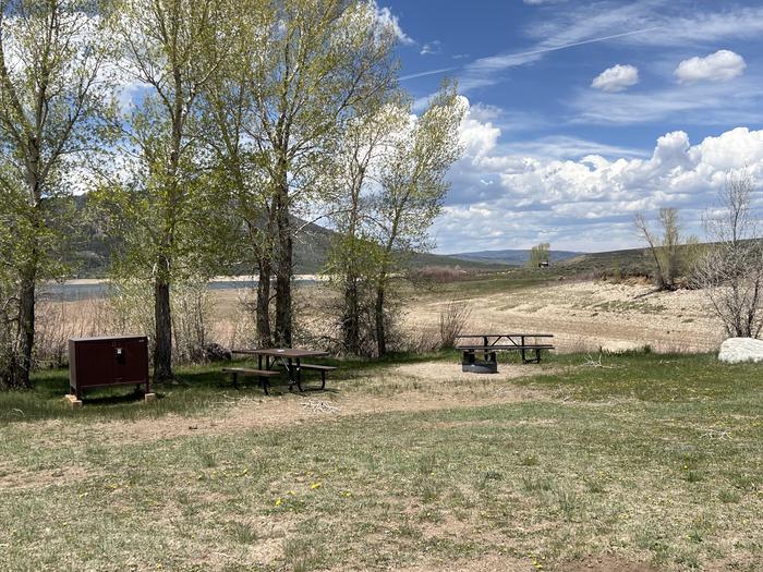 A photo of Site 018 of Loop COW CREEK at COW CREEK SOUTH with Picnic Table, Fire Pit, Food Storage, Tent Pad