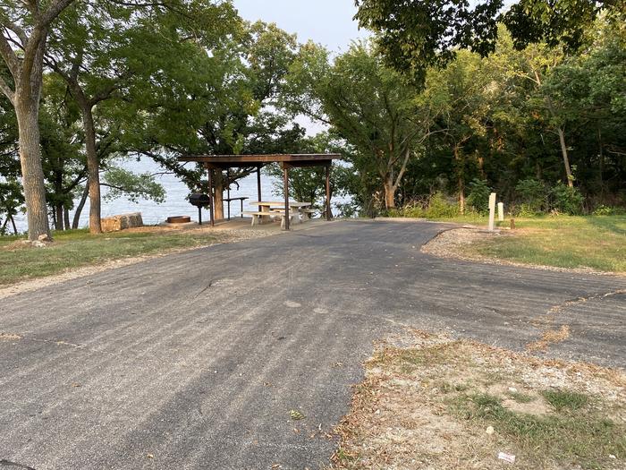 A photo of Site 019 of Loop SFET at SANTA FE TRAIL with Picnic Table, Electricity Hookup, Fire Pit, Shade, Waterfront, Water Hookup