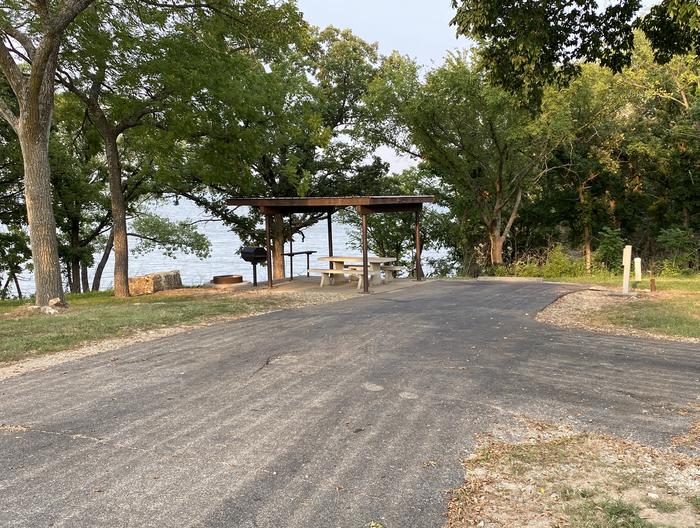 A photo of Site 019 of Loop SFET at SANTA FE TRAIL with Picnic Table, Electricity Hookup, Fire Pit, Shade, Waterfront, Water Hookup
