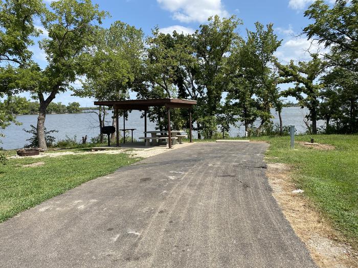 A photo of Site 031 of Loop SFET at SANTA FE TRAIL with Picnic Table, Electricity Hookup, Fire Pit, Shade, Waterfront, Water Hookup