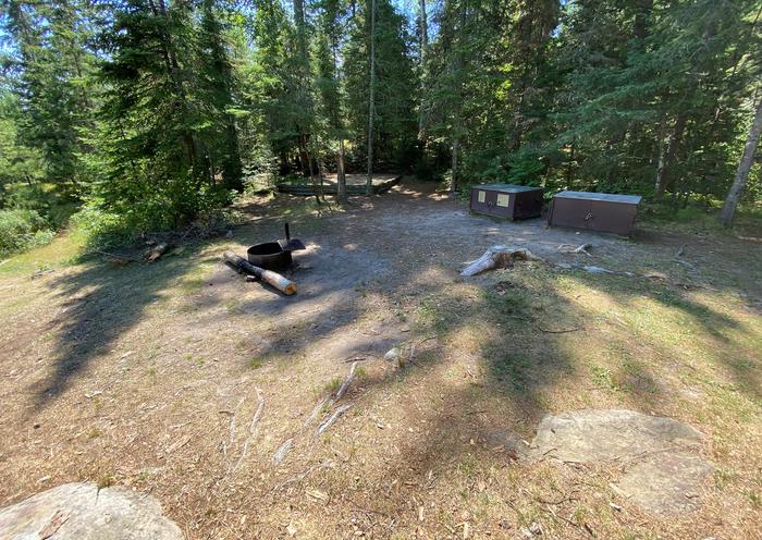 R18 - Little Finlander Island, view looking at campsite with the fire ring and bear boxes.View of campsite