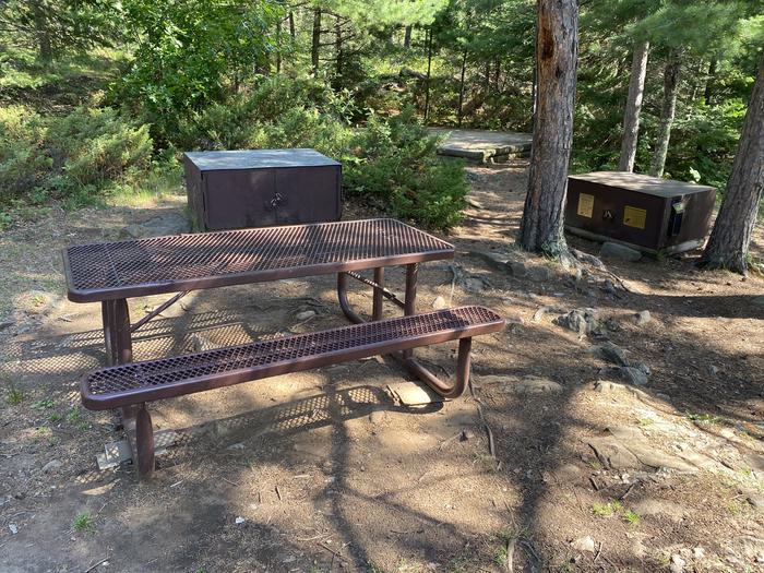 R21 - Nuthatch, view of campsite of the picnic table, bear boxes, and a tent pad in the background.View of campsite