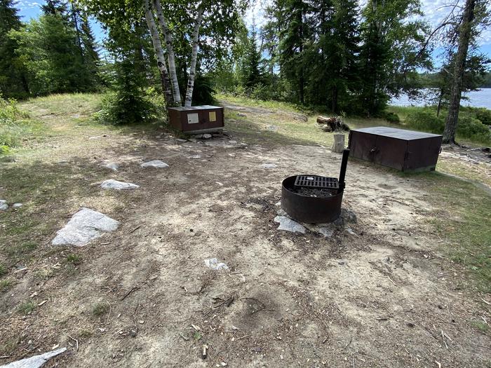R71 - Loon Cove, view looking into the campsite of the fire ring and the bear boxes.View of campsite