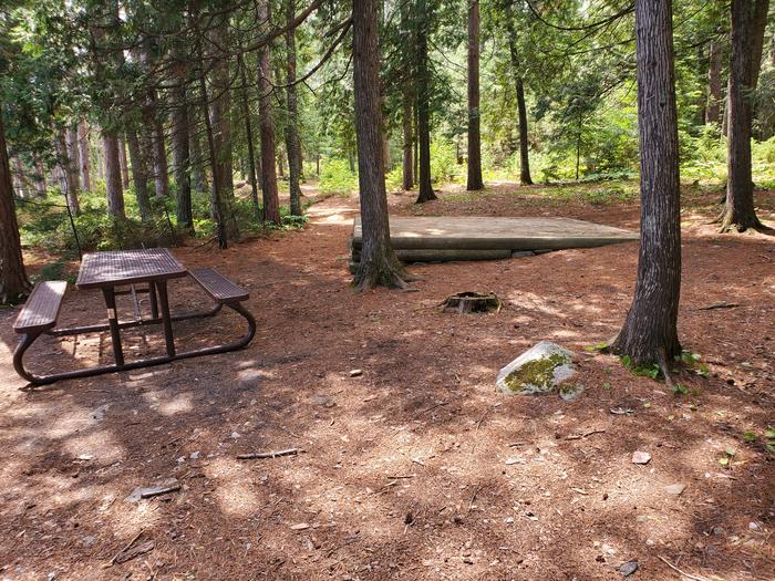 R77 - Three Sisters Island, tent pad #4 at campsite and a picnic table.Tent pad #4