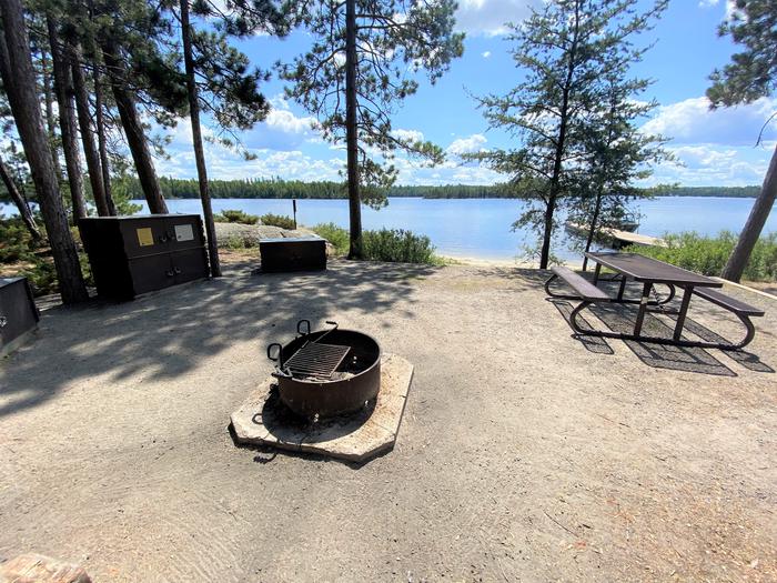 R92 - Blueberry Island West, view looking out of campsite core with water in the background.R92 - Blueberry Island West campsite on Rainy Lake