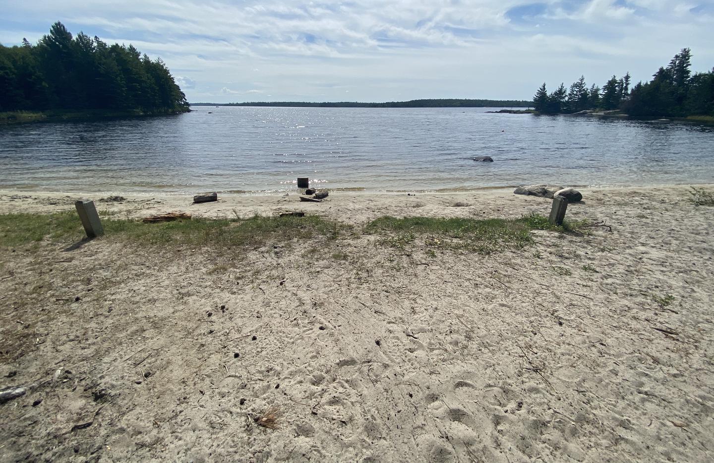 R106 - Shelland Island, view of boat access from shore with a couple of mooring posts.View of boat access from campsite