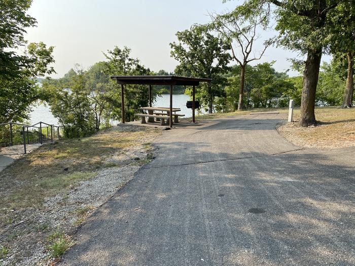 A photo of Site 003 of Loop RCOV at RICHEY COVE with Picnic Table, Electricity Hookup, Fire Pit, Shade
