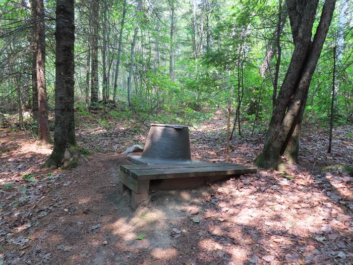 N16 - Kettle Portage, privy with wood step at campsite.Privy