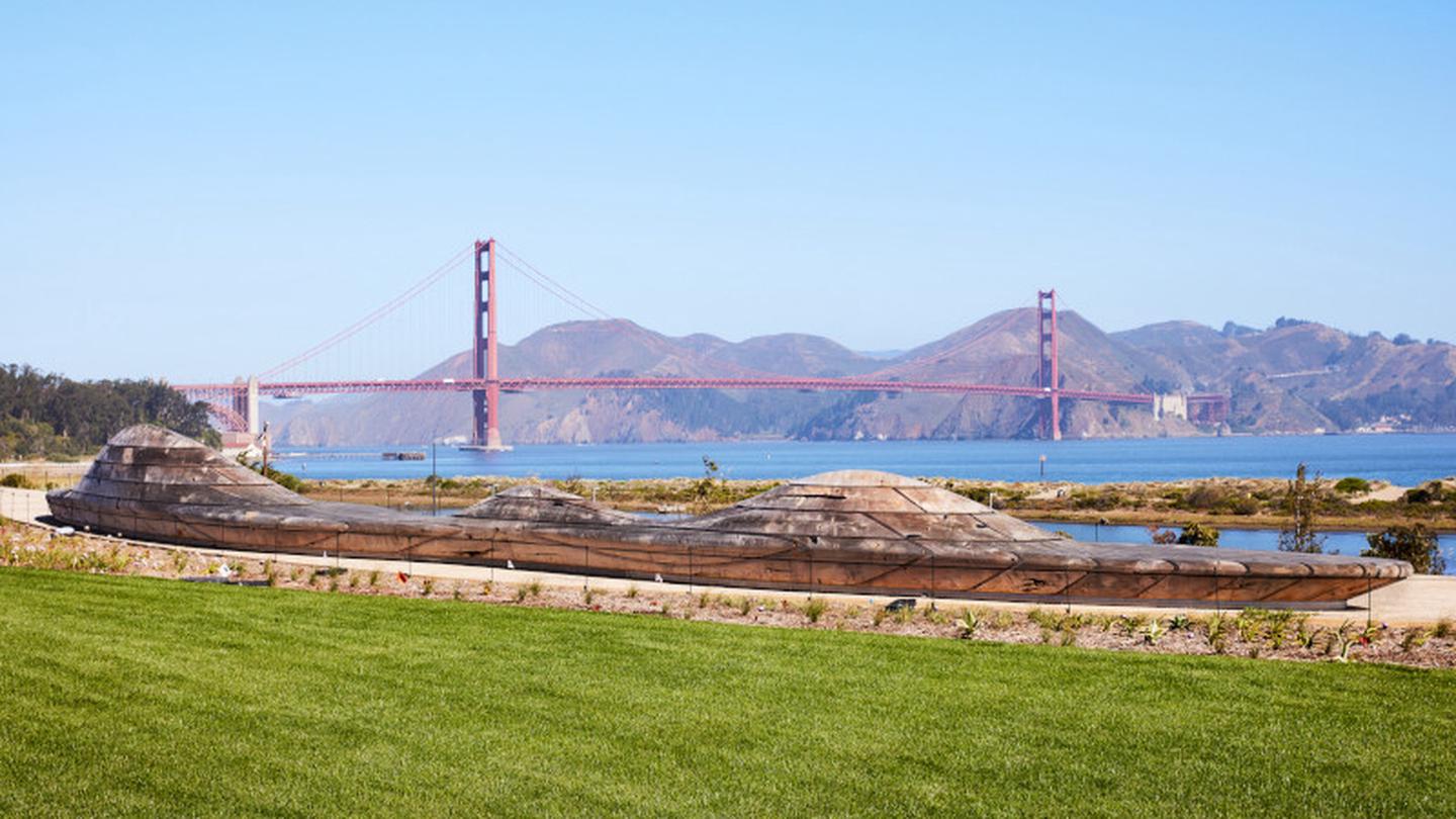 Lawn and benches  with the Golden Gate Bridge in the Bridge and San Francisco Bay in the background The lawns surrounding Picnic Place have exquisite views of the San Francisco Bay and Golden Gate Bridge. 