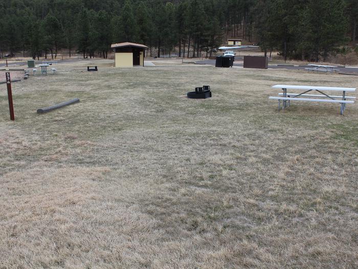 Fire ring, picnic table, restroom, and campsiteSite 53