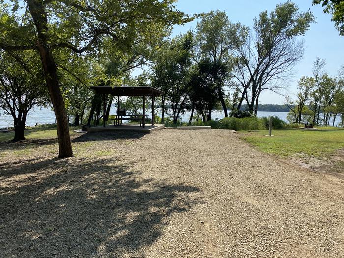 A photo of Site 019 of Loop RCOV at RICHEY COVE with Picnic Table, Electricity Hookup, Fire Pit, Shade, Waterfront