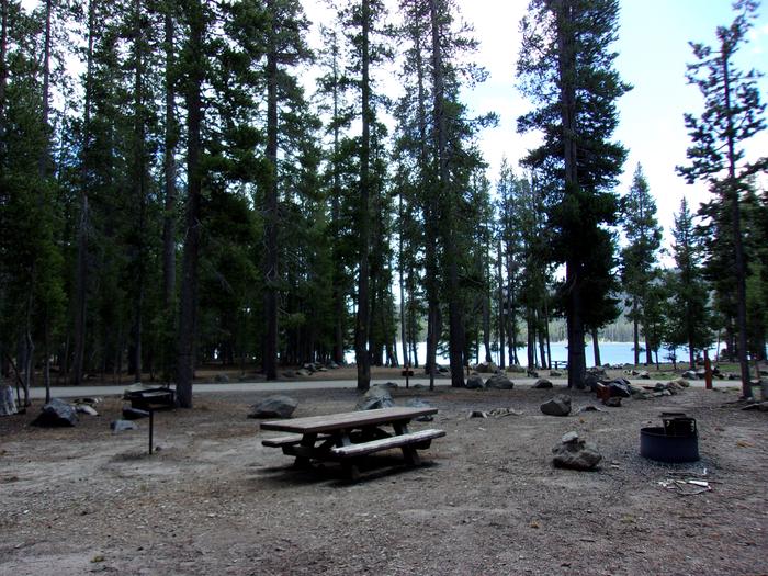 Picnic table, grill and campfire ringSite #19 at Medicine Lake Campground
