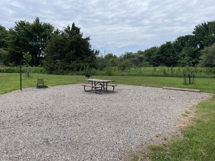 A photo of Site 308 of Loop OAK CAMPGROUND at BLOOMINGTON EAST  with Picnic Table, Fire Pit, Shade, Lantern Pole