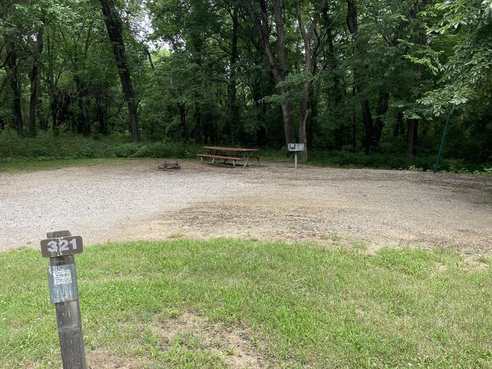 A photo of Site 321 of Loop OAK CAMPGROUND at BLOOMINGTON EAST  with Picnic Table, Fire Pit, Shade, Lantern Pole