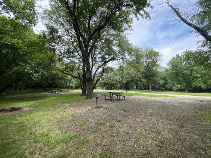 A photo of Site 316 of Loop OAK CAMPGROUND at BLOOMINGTON EAST  with Picnic Table, Fire Pit, Shade, Lantern Pole