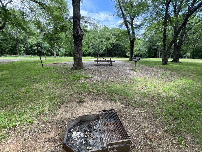 A photo of Site 316 of Loop OAK CAMPGROUND at BLOOMINGTON EAST  with Picnic Table, Fire Pit, Shade, Lantern Pole