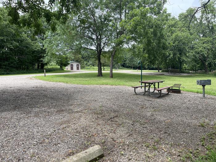 A photo of Site 310 of Loop OAK CAMPGROUND at BLOOMINGTON EAST  with Picnic Table, Fire Pit, Shade, Lantern Pole