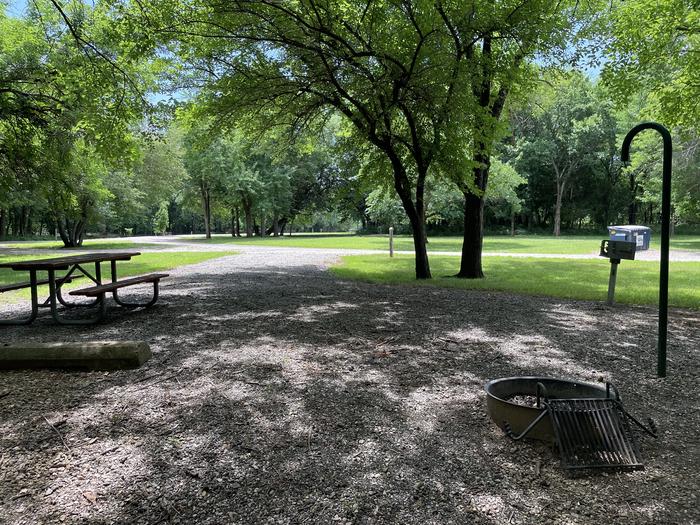 A photo of Site 302 of Loop OAK CAMPGROUND at BLOOMINGTON EAST  with Picnic Table, Fire Pit, Shade, Lantern Pole