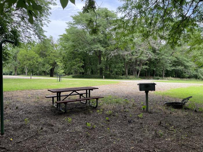 A photo of Site 314 of Loop OAK CAMPGROUND at BLOOMINGTON EAST  with Picnic Table, Fire Pit, Shade, Lantern Pole