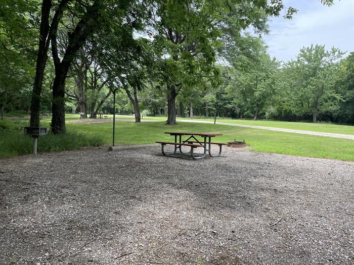 A photo of Site 317 of Loop OAK CAMPGROUND at BLOOMINGTON EAST  with Picnic Table, Fire Pit, Shade, Lantern Pole