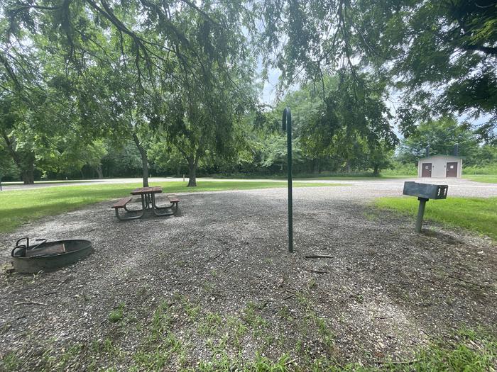A photo of Site 309 of Loop OAK CAMPGROUND at BLOOMINGTON EAST  with Picnic Table, Fire Pit, Shade, Lantern Pole