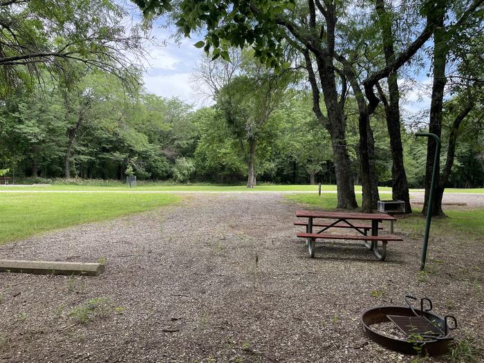 A photo of Site 315 of Loop OAK CAMPGROUND at BLOOMINGTON EAST  with Picnic Table, Fire Pit, Shade, Lantern Pole