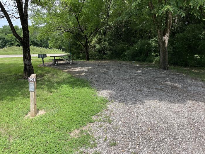 A photo of Site 301 of Loop OAK CAMPGROUND at BLOOMINGTON EAST  with Picnic Table, Fire Pit, Shade, Lantern Pole