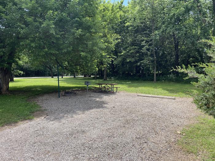 A photo of Site 300 of Loop OAK CAMPGROUND at BLOOMINGTON EAST  with Picnic Table, Fire Pit, Shade, Lantern Pole