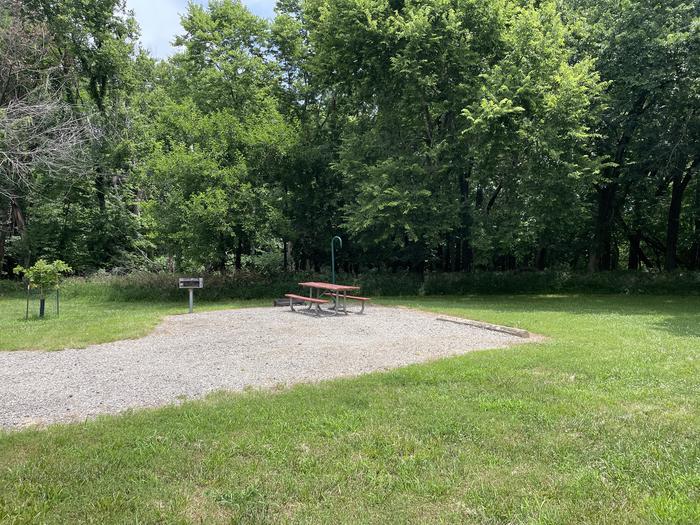 A photo of Site 305 of Loop OAK CAMPGROUND at BLOOMINGTON EAST  with Picnic Table, Fire Pit, Shade, Lantern Pole