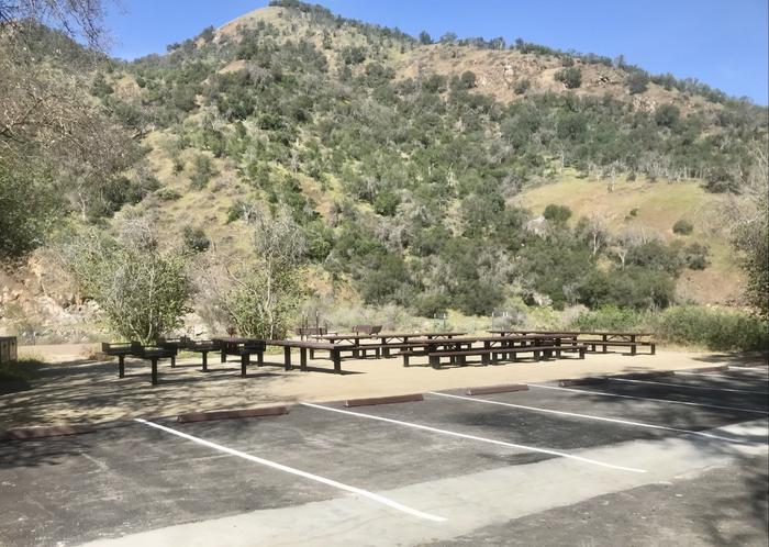 Picnic table and grills.There is plenty of room here with picnic tables, grills, and parking.