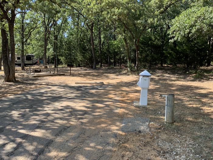 A photo of Site 025 of Loop HICKORY CREEK  at HICKORY CREEK with Boat Ramp, Picnic Table, Electricity Hookup, Fire Pit, Shade, Lantern Pole, Water Hookup