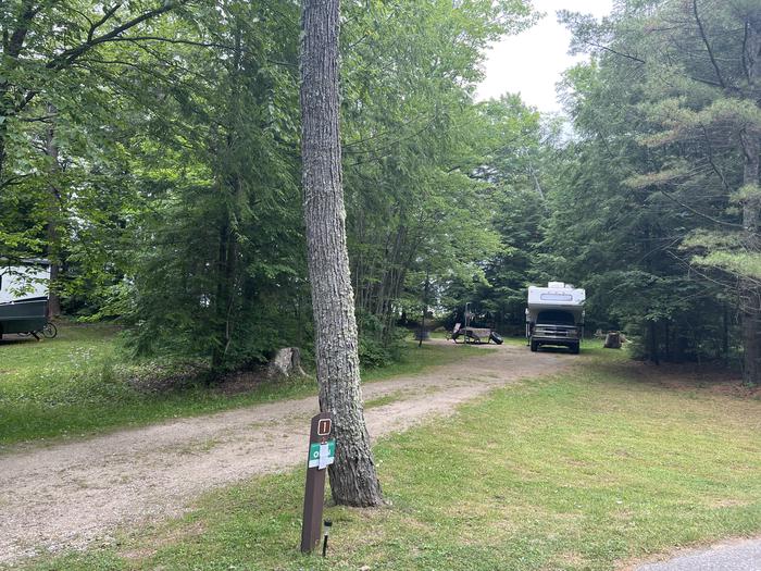 A photo of Site X01 of Loop MANAGEMENT SITES at BREVOORT LAKE CAMPGROUND with Picnic Table, Fire Pit, Shade, Waterfront, Lantern Pole