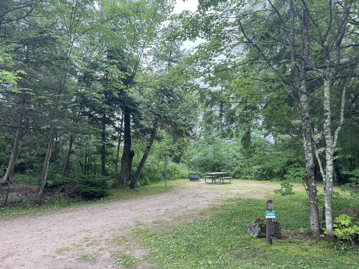 A photo of Site X21 of Loop MANAGEMENT SITES at BREVOORT LAKE CAMPGROUND with Picnic Table, Fire Pit, Shade, Waterfront, Lantern Pole