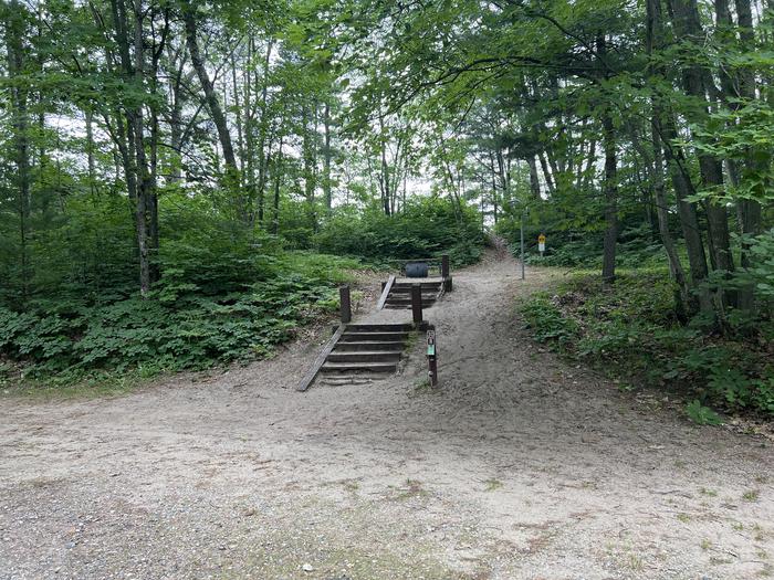A photo of Site 030 of Loop LAKE MICHIGAN AT ST. IGNACE at LAKE MICHIGAN AT ST. IGNACE with Picnic Table, Fire Pit, Shade, Lantern Pole
