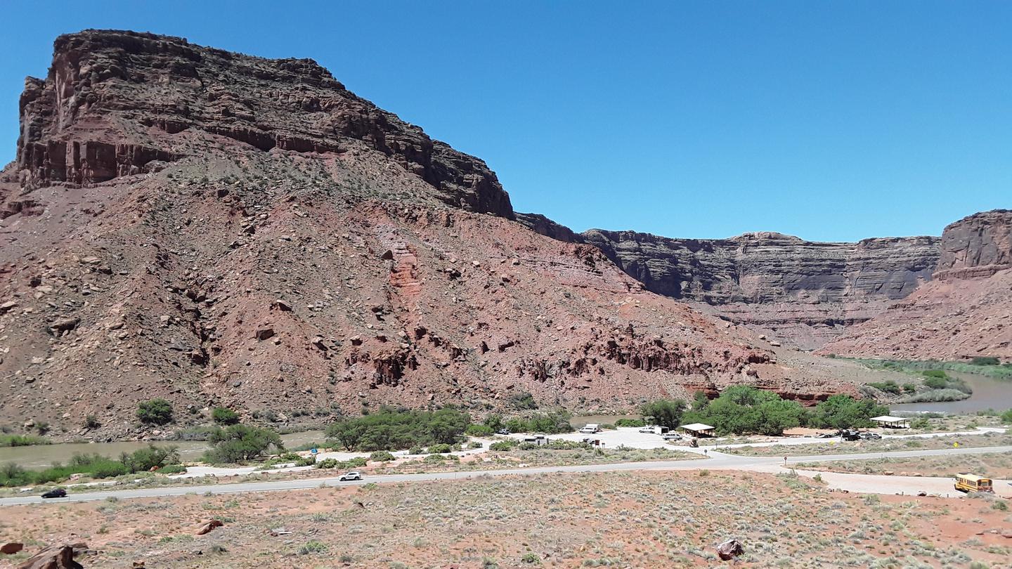 Broad view of Big Bend Campground with Colorado River and red rock canyon walls