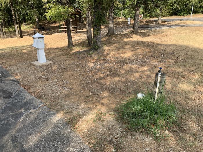 A photo of Site 067 of Loop HICKORY CREEK  at HICKORY CREEK with Boat Ramp, Picnic Table, Electricity Hookup, Fire Pit, Shade, Lantern Pole, Water Hookup