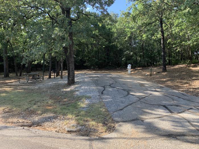 A photo of Site 038 of Loop HICKORY CREEK  at HICKORY CREEK with Picnic Table, Electricity Hookup, Fire Pit, Shade, Lantern Pole, Water Hookup