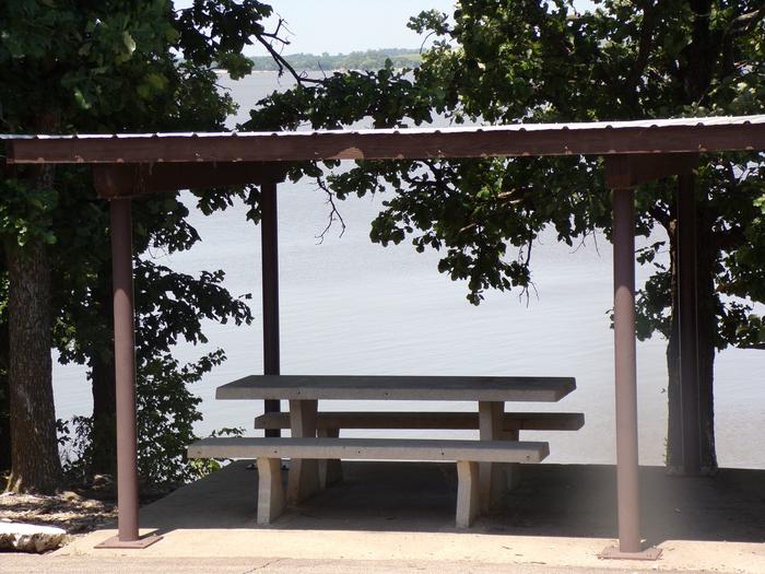 Site 15 of Loop SFET at SANTA FE TRAIL with Picnic Table with view of the lake