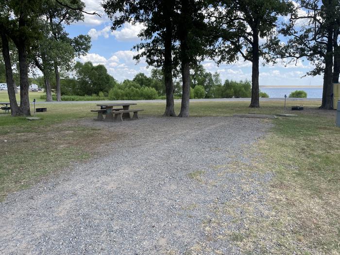 A photo of Site 018 of Loop BRUE at BURNS RUN EAST with Picnic Table, Electricity Hookup, Fire Pit, Shade, Water Hookup