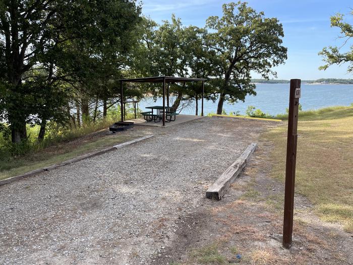 A photo of Site 11 of Loop PBEN at PRESTON BEND with Picnic Table, Fire Pit, Shade, Waterfront
