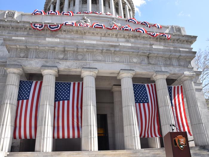 Granite exterior of mausoleum draped in American flags Ulysses and Julia Grant's tomb is decorated with American flags each year in the summer.