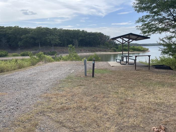 A photo of Site C18 of Loop C at BUNCOMBE CREEK with Picnic Table, Electricity Hookup, Fire Pit, Waterfront, Water Hookup
