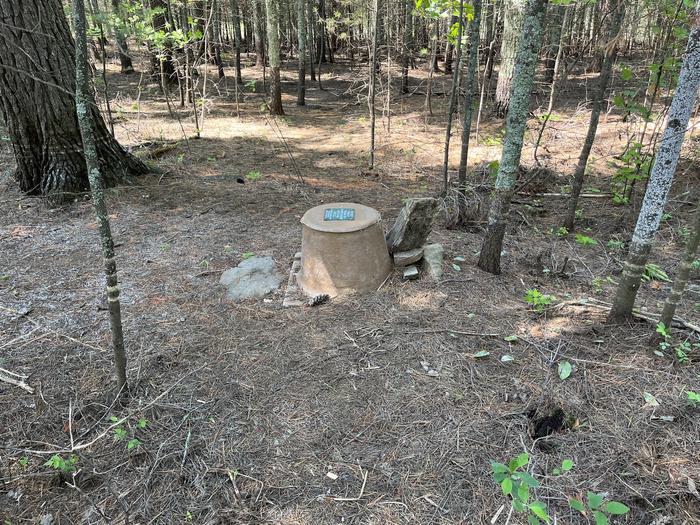 R1 - Alder Creek, view of the privy at campsite in the woods.Privy at campsite